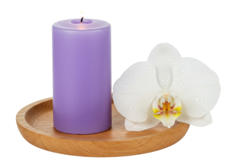 Isolated wellness still life of a lit lilac candle and a white orchid blossom on a round tray