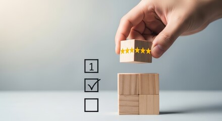 Hand arranging wooden cube block with five star symbol for satisfaction rating