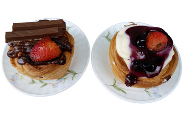 Two pastries with different toppings on plates look delightful and tempting, ready to be devoured for sweet treat and satisfying indulgence