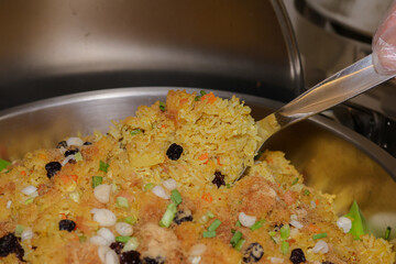 Aromatic Rice Dish Served: A close-up shot captures the serving of a delectable rice dish. Each grain of rice is a testament to culinary expertise. 