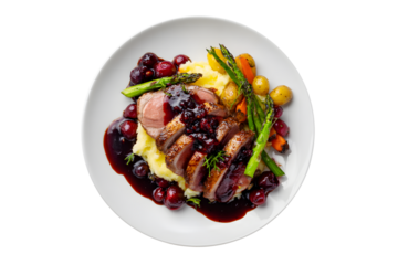 Roast duck breast with mashed potatoes, vegetables, and berry sauce on a white plate, isolated on transparent background