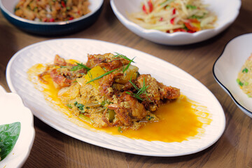 Golden Culinary Creation: A vibrant and appetizing array of delicious dishes, artfully arranged on a pristine table, each promising an explosion of taste. A visual symphony of textures and colors.