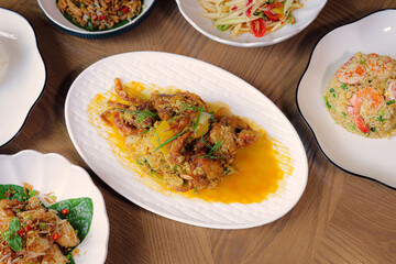 Culinary Spread: A vibrant and enticing photo showcases an array of delectable dishes, each a testament to culinary artistry and flavor. From savory entrees to tempting accompaniments.