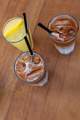 iced coffee and lemonade on wooden table top view