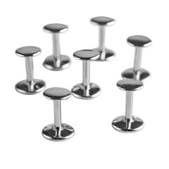 Seven small, round, polished metal stools arranged in a cluster