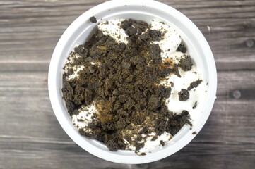 Pieces of cookies, caramel sauce, biscuit and vanilla ice cream, pieces of cookies and biscuits rich in caramel toppings of a vanilla ice cream, summertime and holidays concept