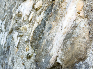 Rough stone texture with natural patterns and varied colors