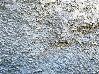 Close-up of rough natural rock surface with unique texture and patterns