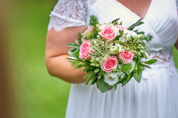 bride holding bouquet of flowers