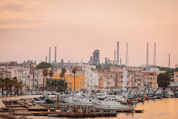 Boats in Taranto port with industrial background