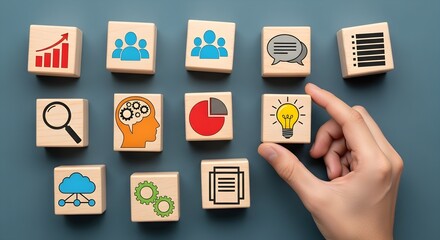 A hand is holding a block with a lightbulb icon, surrounded by other blocks with business-related symbols, on a blue background.