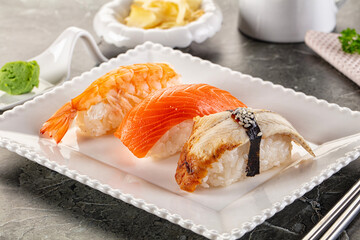 Japanese cuisine - sushi with eel, salmon and prawn