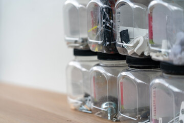 Transparent Storage Jars with Screws, Bolts, and Hardware Parts