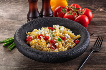 Italian pasta fusili with curd