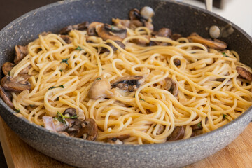 creamy mushroom pasta cooked in a pan, perfect for a cozy fall recipe