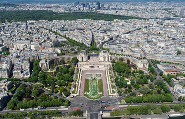 Paris, France, cityscape displaying the iconic Palais de Chaillot with its grand architecture and surrounding gardens, offering a panoramic view of the vast urban landscape and historical heritage