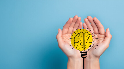 Hands holding brain light bulb icon for mental health and awareness