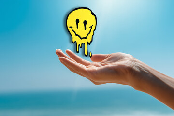 Hands holding melting smiley face symbolizing mental health struggles
