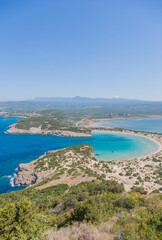 Fototapeta premium View over Voidokilia beach, wildlife refugee Limni Ntivari-Valtos and mediterranean sea from Palaiókastro, ancient greek castle at Peloponnes, near Pylos, Greece (vertical)