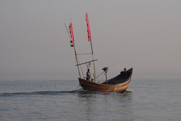 Small Wooden Fishing Boat on Meghna River &ndash; Scenic River Photography