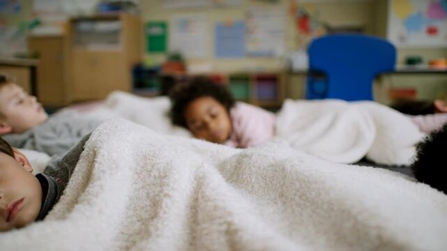 Young children napping peacefully under soft blankets, classroom setting evokes a calm learning environment, diverse kids resting during a midday break