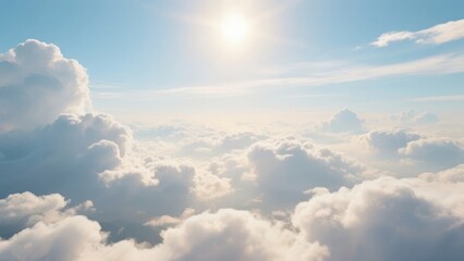 Aerial view of fluffy white clouds under bright sunlight in a clear blue sky