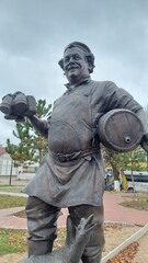 Sculpture of a Brewer with a barrel and a goose in the village of Zheleznodorozhny