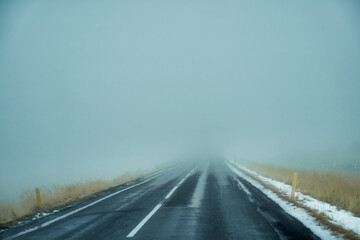 Heavy mist on the road for road trip in Icelnad travel , unpredict weather for travel.