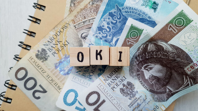 OKI acronym made of wooden letter cubes. Osobiste Konto Inwestycyjne (Personal Investment Account)