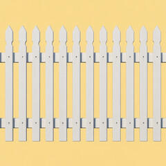 Classic white picket fence against a soft yellow background