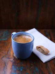 Cup of coffee on rustic wooden background. Soft focus. Copy space	