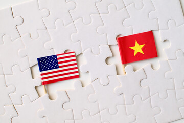 United States and Vietnam flags on puzzle pieces, symbol of partnership, cooperation, and...
