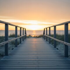 Wooden boardwalk extends toward sunset over ocean at