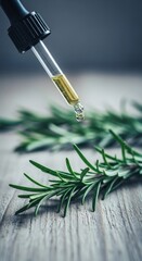 Rosemary oil dispensing onto sprigs in a wellness composition