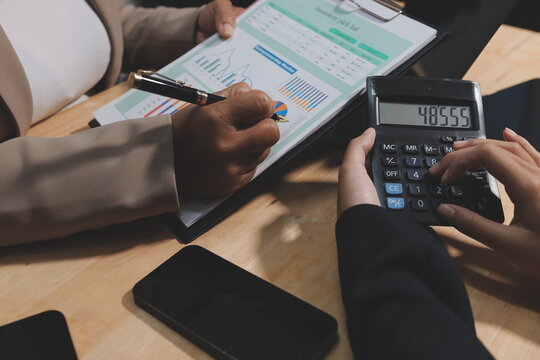 Accounting company provide finance and taxation planning for profitable cash flow, Auditor and accountant team working in office, analyze financial data and accounting record with calculator.Insight