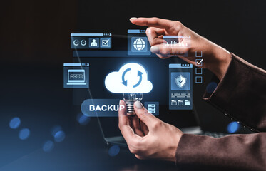 Cloud backup interface with digital icons and person interacting on dark background.