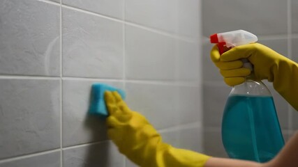 Cleaning tiles with cleaning supplies - Powered by Adobe
