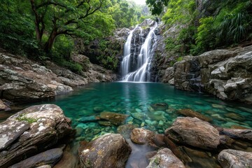Fototapeta premium Tranquil Waterfall Cascading into a Clear Pool