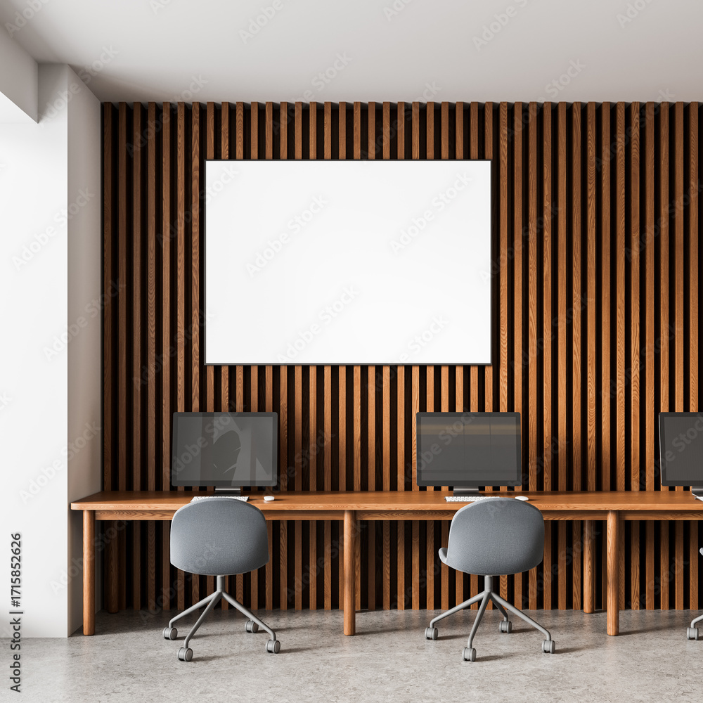 Poster modern workspace interior with wooden slat wall, blank poster mockup, and computer desks creating a 