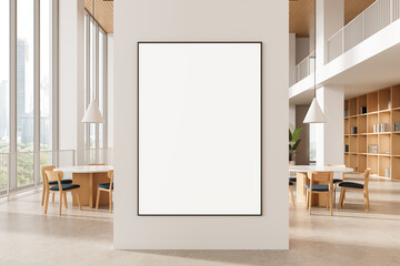 Vertical poster mockup on modern interior wall in bright open office with wood furniture and bookshelves near large glass windows in daylight. 3D Rendering