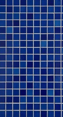 A repeating pattern of small, square, vibrant blue tiles with white grout lines creates a visually appealing, uniform texture.