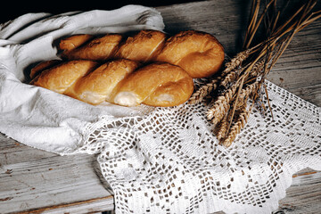 Delectably Freshly Baked Bread with Rustic Elements Stylishly Set on a Wooden Table