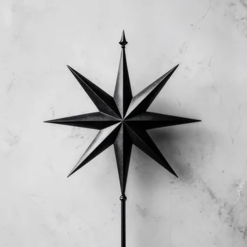 Minimalist abstract black star on a marble background