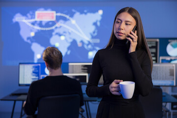 Female Incident Responder Analyzing Data in Cybersecurity Operations Center