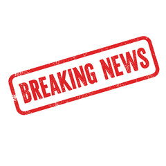 A red rubber stamp displaying the words breaking news on white background