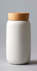 White ceramic jar with a light brown wooden lid