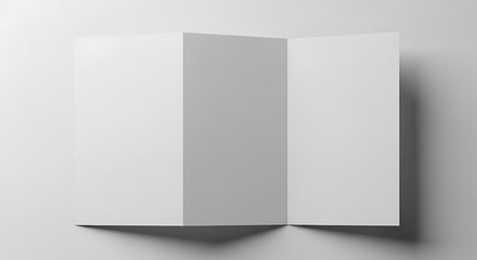 Blank white trifold brochure mockup lies open on a clean white surface, ready for branding and advertising, creating a sense of minimalist professionalism.