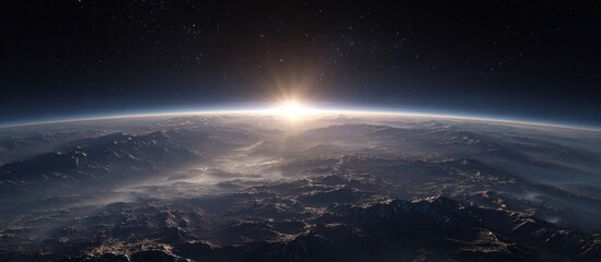 Earth sunrise view from space, mountains and atmospheric haze visible
