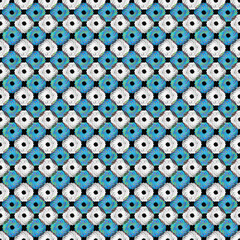 Repeating tiles of blue and white floral patterns on a black surface.
A black surface features a repeating tile pattern of blue and white floral designs. 
