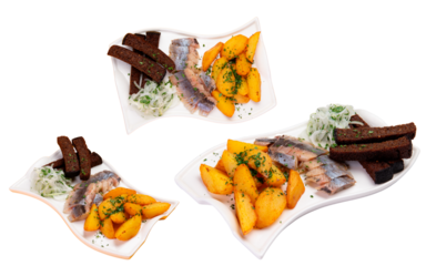 Herring, rye croutons, and potatoes on a plate. Appetizer. Transparent.